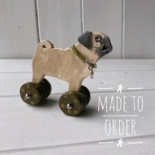 Load image into Gallery viewer, Pug &quot;Woof on Wheels&quot; ceramic ornament
