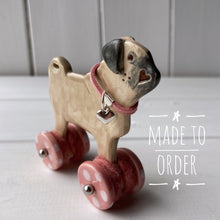 Load image into Gallery viewer, Pug &quot;Woof on Wheels&quot; ceramic ornament
