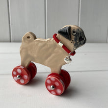 Load image into Gallery viewer, Pug &quot;Woof on Wheels&quot; ceramic ornament
