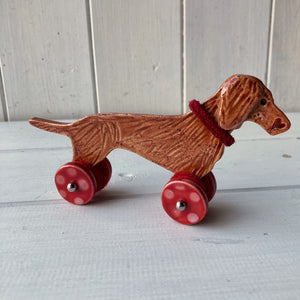 Red Dachshund "Woof on Wheels"