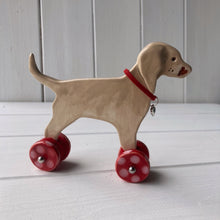 Load image into Gallery viewer, Weimaraner Ceramic &quot;Woof on Wheels&quot; Ornament
